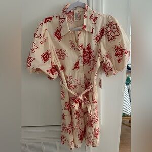 Cream dress with red print, cinched waist and puff sleeves
